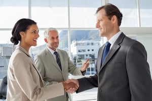 Businessman introducing a colleague to another businessman