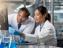 Firefly Engineers working together in a lab space on a disease testing device 89464